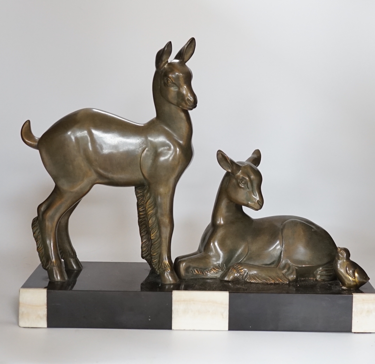 An Art Deco patinated spelter twin goat group on marble base, etched ‘Rochard’ on base, 36cm high